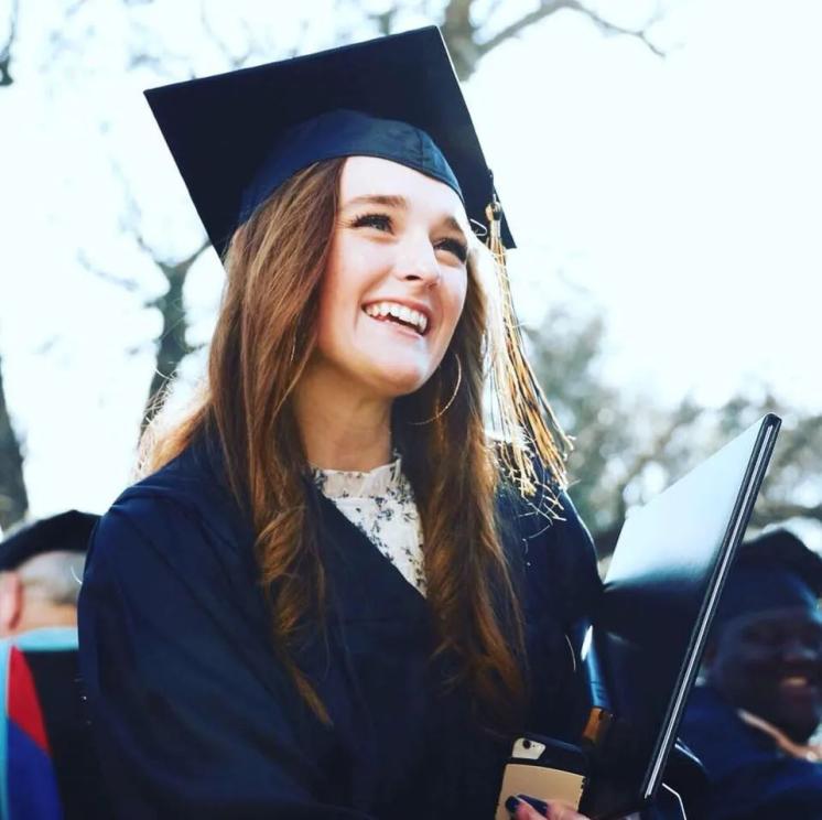 Gabi Henley Woman in her cap and gown smiling