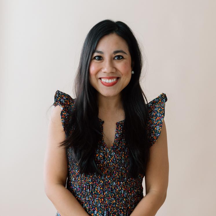 A woman smiling at the camera