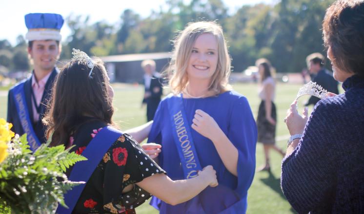 The 2018 Homecoming Queen, Caroline Lowe, is crowned by ETBU First Lady Michelle Blackburn and 2017 Homecoming Queen Halee Vasquez. ETBU President J. Blair Blackburn crowned Homecoming King, Collin Perkins, during the Homecoming halftime.
